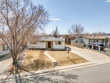 Charming single-story home with a well-maintained front yard and a 'for sale' sign at 340 Cortez St, Denver, CO 80221