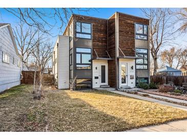 Modern duplex with unique wood and concrete facade, large windows, and well-maintained lawn at 4129 Zenobia St, Denver, CO 80212