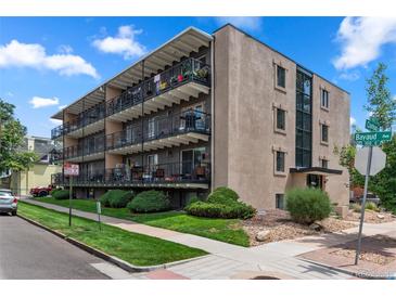 Attractive multi-unit building with landscaping and street parking at 100 S Clarkson St # 105, Denver, CO 80209