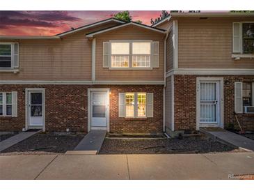 Charming brick townhouse featuring a well-maintained exterior and inviting entrance at 1534 S Ouray Cir # B, Aurora, CO 80017