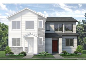 Two-story modern home with gray and white exterior, stone accents and landscaping at 1434 Coral Pl, Longmont, CO 80504