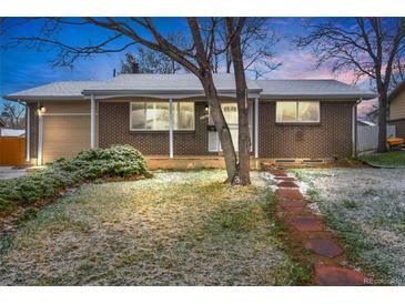 Charming brick home with a well-maintained lawn and inviting walkway at 9360 Lowell Blvd, Westminster, CO 80031