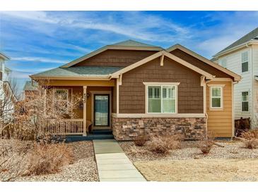 Charming single-Gathering home with stone accents and well-maintained front yard at 4322 N Meadows Dr, Castle Rock, CO 80109