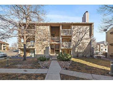 Inviting multi-story condo building featuring private balconies, tidy landscaping, and a welcoming entrance at 4068 S Atchison Way # 301, Aurora, CO 80014