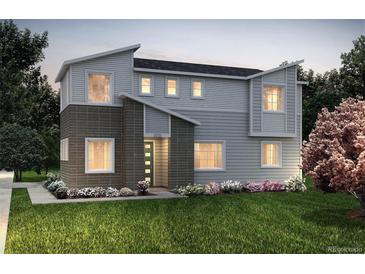 Charming two-story home with a modern design and manicured lawn at 23981 E 40Th Ave, Aurora, CO 80019