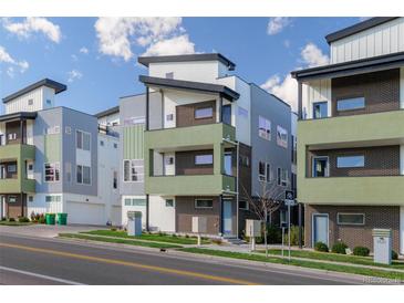 Contemporary townhome with eye-catching mixed materials and stylish architectural details at 1615 Harlan St # 2, Lakewood, CO 80214