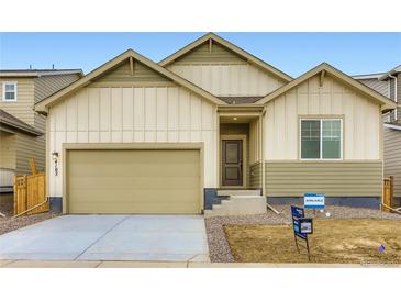 Charming single Gathering home featuring a two-car garage and neutral-toned exterior at 4102 Estrella St, Brighton, CO 80601
