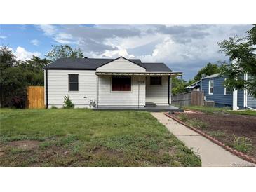 Charming one-story home with a well-maintained lawn and an inviting front porch at 5030 Beach Ct, Denver, CO 80221