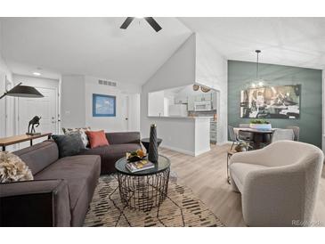 Inviting living room featuring modern furniture, an open layout and bright, neutral decor at 6755 S Field St # 625, Littleton, CO 80128