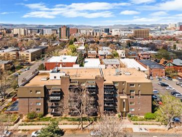 A high-angle captures this property's prime city location amidst the vibrant urban landscape and mountain views at 1233 N Ogden St # 610, Denver, CO 80218