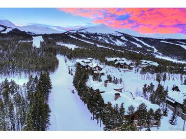Aerial view of luxurious homes in a snowy mountain community at 457 Timber Trail Rd, Breckenridge, CO 80424