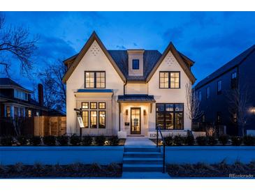 Elegant two-story home showcasing its beautiful white brick facade and modern architectural design at 1120 S Gaylord St, Denver, CO 80210