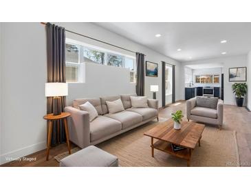 Bright living room features modern furnishings and decor at 4745 N Clay St, Denver, CO 80211
