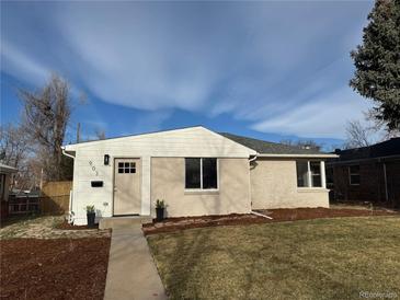 Charming single-story home featuring a well-maintained lawn and freshly painted exterior at 903 Poplar St, Denver, CO 80220