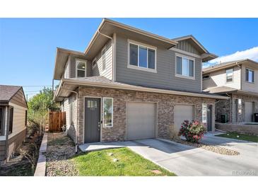 Modern two-story home with stone accents and a two-car garage at 921 Raleigh St, Denver, CO 80204