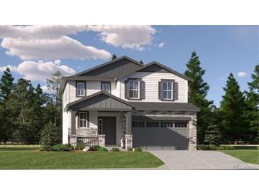 Charming two-story home with a manicured lawn, gray trim, and stone accents on the facade at 11029 Snowdon St, Parker, CO 80134