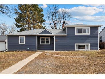 Charming blue single-Gathering home with a well-maintained lawn and inviting curb appeal at 2930 S Birch St, Denver, CO 80222