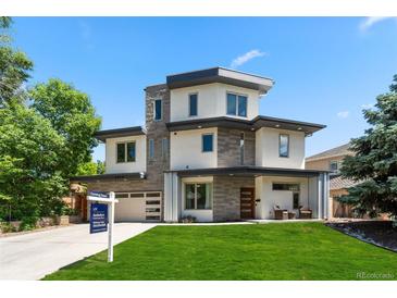 Modern two-story home with a well-manicured lawn and contemporary design elements at 2564 S Carey Way, Denver, CO 80222