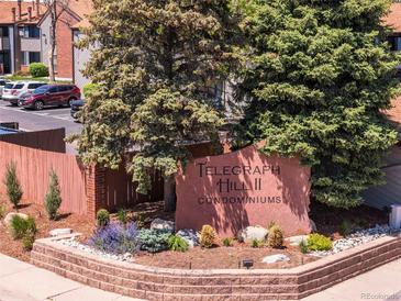 Well-maintained Telegraph Hill II Condominiums entrance with mature landscaping and signage at 12053 E Harvard Ave # 107, Aurora, CO 80014