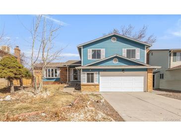 Charming two-story home with a two-car garage and inviting curb appeal at 4121 S Andes Way, Aurora, CO 80013