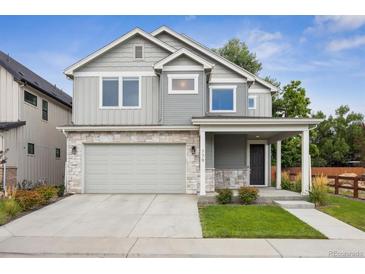 Charming two-story home with stone accents, attached two car garage, and well maintained lawn at 779 Kohlor Dr, Lafayette, CO 80026