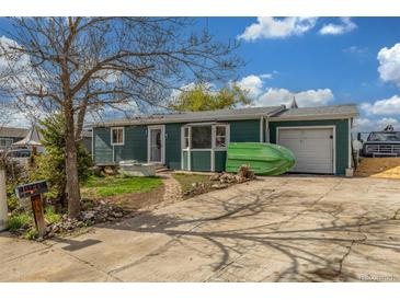 Charming home featuring a cozy porch, attached garage, and a well-maintained front yard at 15785 W Second Ave, Golden, CO 80401