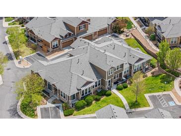 Stunning aerial view of modern townhomes with lush landscaping and accessible parking at 3751 W 136Th Ave # L1, Broomfield, CO 80023