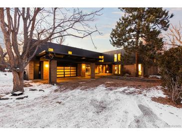 Stunning contemporary home with covered entry and spacious driveway at 7177 W 8Th Ave, Lakewood, CO 80214