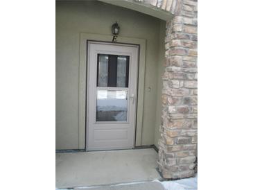 Inviting front door entrance with stone accents at 2239 Calais Dr # E, Longmont, CO 80504