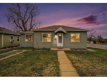 Charming home featuring a well-manicured lawn and inviting facade at dusk at 5100 Clay St, Denver, CO 80221