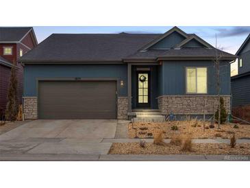 Charming single-Gathering home with a well-manicured front yard and attached two-car garage at 18175 W 94Th Ave, Arvada, CO 80007