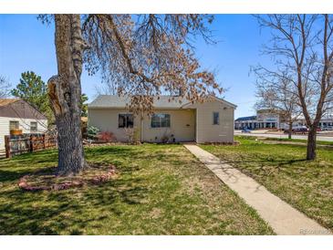 Charming single-story home featuring a well-maintained lawn and mature trees in a suburban setting at 3492 S Elm St, Denver, CO 80222