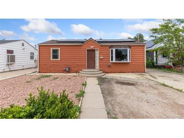 Charming single-story home featuring solar panels, a bay window, and low-maintenance landscaping at 544 S 3Rd Ave, Brighton, CO 80601