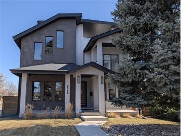 Stunning modern two-story home featuring mixed materials of gray brick and white siding with professional landscaping at 2540 Xavier St, Denver, CO 80212