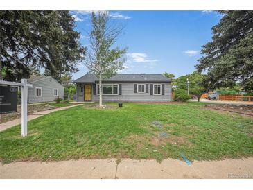 Charming gray home featuring a well-maintained front yard and a welcoming entrance at 1801 S Eudora St, Denver, CO 80222