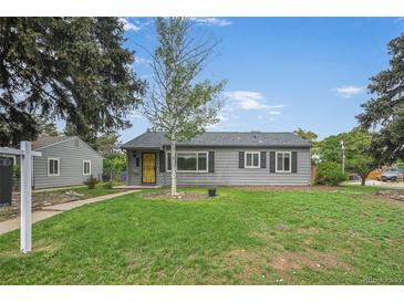 Charming single-story home with a well-maintained lawn and a detached garage, and a bright yellow front door at 1801 S Eudora St, Denver, CO 80222