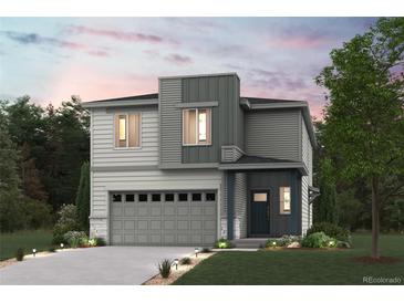 Charming two-story home features a two-car garage, modern architecture, and a well-manicured lawn at 19058 E 94Th Pl, Commerce City, CO 80022
