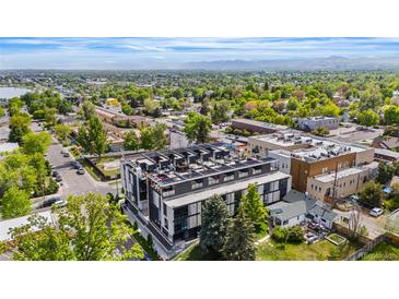 Modern building with rooftop terraces and views of lush surroundings and mountains in the background at 5125 W 29Th Ave # 5, Denver, CO 80212