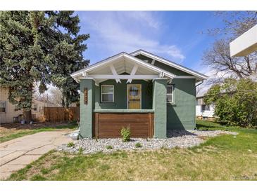 Charming bungalow with a well-maintained front yard and inviting porch at 1777 Spruce St, Denver, CO 80220