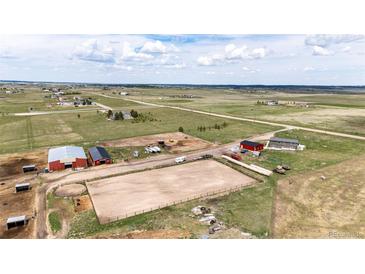 Expansive aerial view of the acreage and outbuildings on the property at 28505 County Road 5, Elizabeth, CO 80107