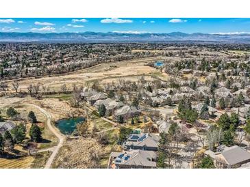 Stunning aerial view showcasing the neighborhood, open space, and mountain views at 32 Silver Fox Cir, Greenwood Village, CO 80121