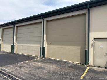 Row of modern storage units, featuring large doors and secure access, ideal for commercial storage at 7152 S Blackhawk St # C12, Englewood, CO 80112