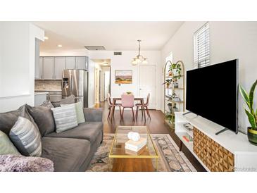 Bright living room featuring modern furniture, a stylish rug, and ample space for relaxation and entertainment at 2773 Roslyn St, Denver, CO 80238
