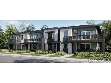 Modern townhome exterior featuring individual balconies and landscaped front yards at 8939 San Antonio St, Littleton, CO 80125