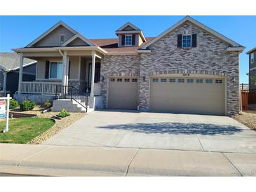 Charming home with a two-car garage and inviting front porch at 7658 Oasis Dr, Castle Rock, CO 80108