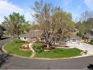 Stunning aerial view of a ranch style home showcasing mature landscaping and a circular driveway at 4951 Sanford W Cir, Cherry Hills Village, CO 80113