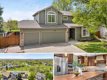 Inviting two-story home featuring a two-car garage, well-maintained lawn, and charming architectural details at 3418 Elk Ct, Broomfield, CO 80020