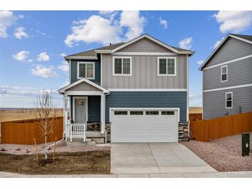 Charming two-story home with a two-car garage and landscaped front yard at 17817 Dandy Brush Dr, Parker, CO 80134