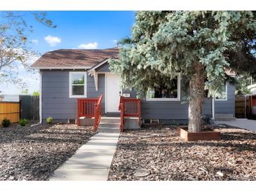 Charming home featuring well-maintained landscaping and a welcoming front porch at 3471 W Exposition Ave, Denver, CO 80219