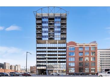 Modern high-rise building with parking garage and mixed brick-and-glass exterior under a clear blue sky at 2020 Arapahoe St # 1150, Denver, CO 80205